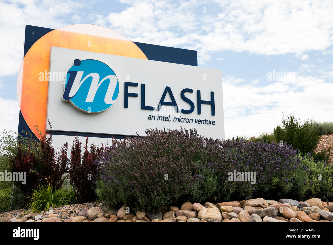 A logo sign outside of the headquarters of IM Flash Technologies in Lehi, Utah on July 27, 2019. Stock Photo
