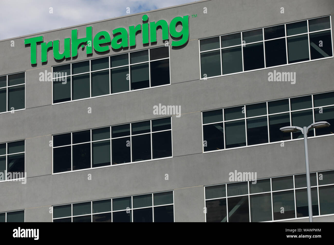 A logo sign outside of the headquarters of TruHearing in Draper, Utah