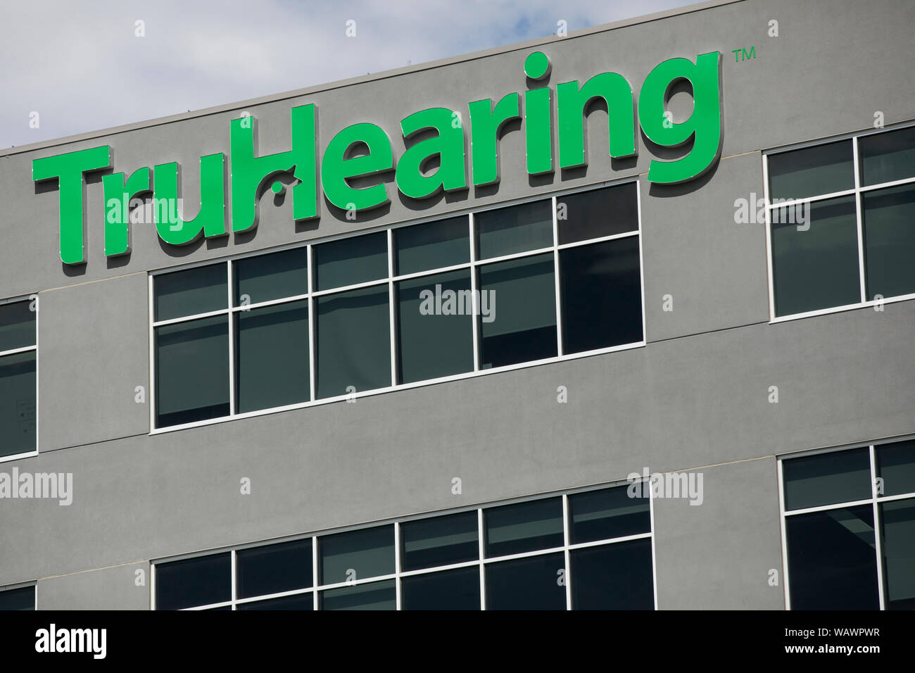 A logo sign outside of the headquarters of TruHearing in Draper, Utah