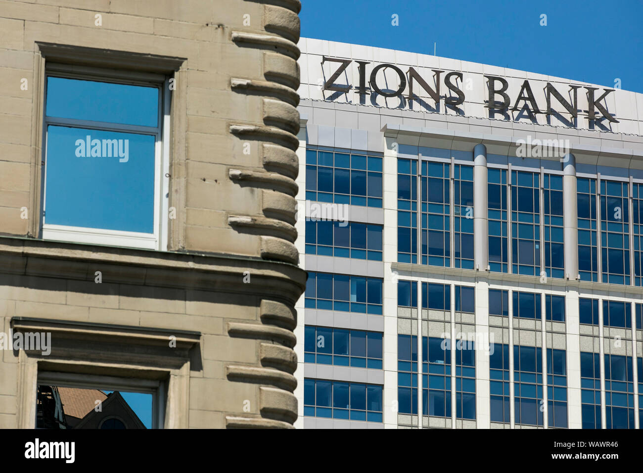 A logo sign outside of the headquarters of Zions Bank in Salt Lake City