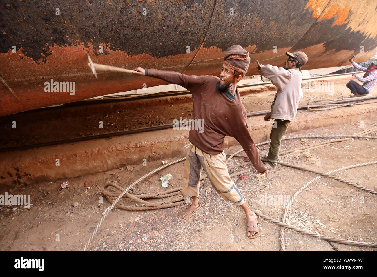 Dock workers in a shipyard in Dhaka, Bangladesh. Shipbuilding in Bangladesh has become a major industry in recent years. Stock Photo