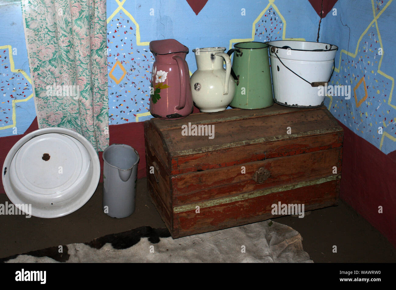 Old water jug and bowl inside Basotho hut, Basotho Cultural Village ...