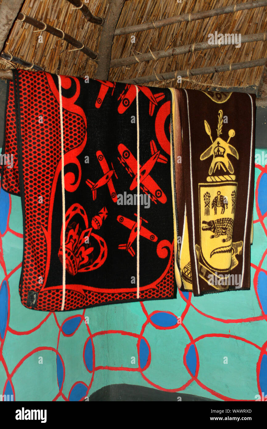 Heritage blankets hanging inside Basotho hut, Basotho Cultural Village