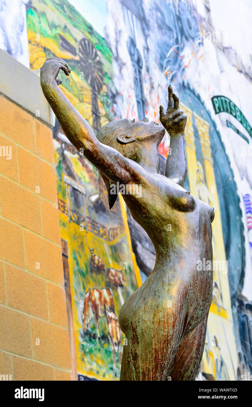 Detail of woman in 'Our Lady of Pittsburg' 2003 bronze statue in Heritage Plaza, 4th Street Pittsburg California.  Sculptor Jason Greigo. Stock Photo