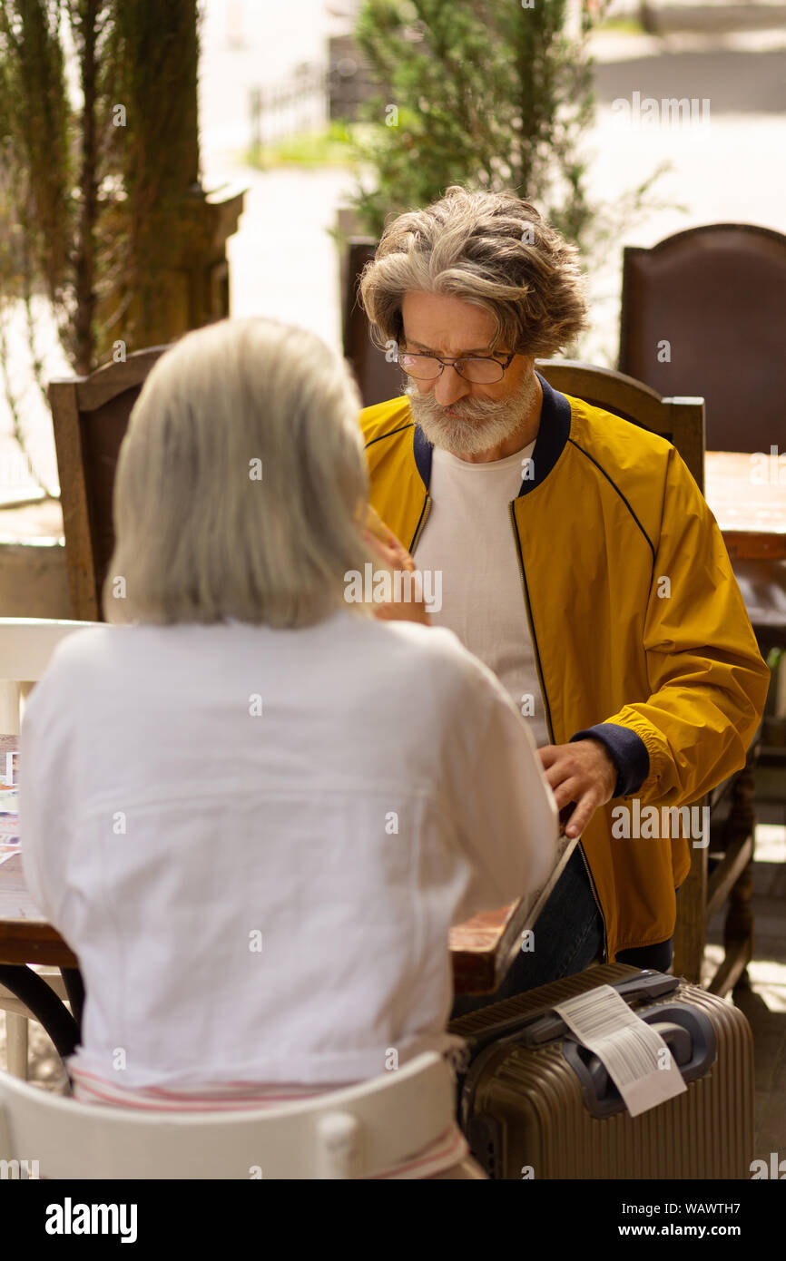 Husband and wife having lunch after the arrival. Stock Photo