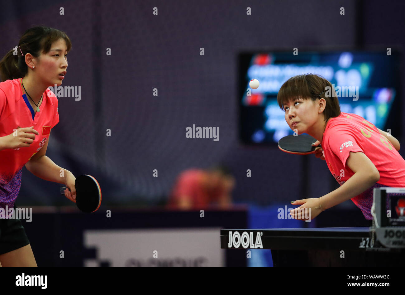 Olomouc, Czech Republic. 22nd Aug, 2019. Chen Xingtong (R)/Qian Tianyi of China compete during a women's doubles round of 16 match against Stephanie Loeuillette/Audrey Zarif of France during 2019 ITTF Czech Open in Olomouc, the Czech Republic, Aug. 22, 2019. Credit: Shan Yuqi/Xinhua/Alamy Live News Stock Photo