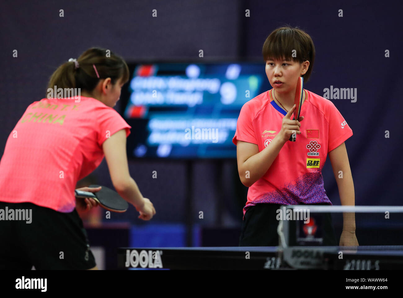 Olomouc, Czech Republic. 22nd Aug, 2019. Chen Xingtong (R)/Qian Tianyi of China compete during a women's doubles round of 16 match against Stephanie Loeuillette/Audrey Zarif of France during 2019 ITTF Czech Open in Olomouc, the Czech Republic, Aug. 22, 2019. Credit: Shan Yuqi/Xinhua/Alamy Live News Stock Photo