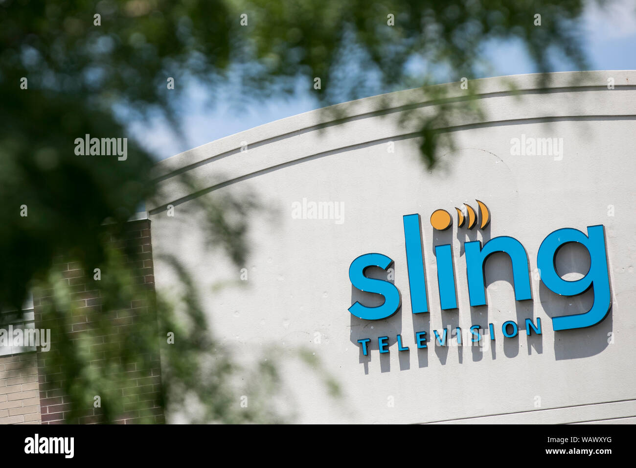 A logo sign outside of a facility occupied by Sling Television in American Fork, Utah on July 27, 2019. Stock Photo