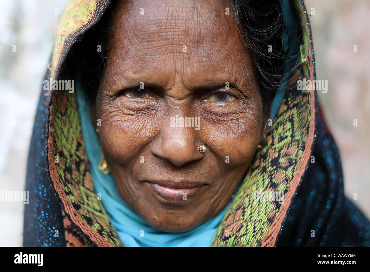 Elderly Muslim market woman in Barisal, Bangladesh Stock Photo