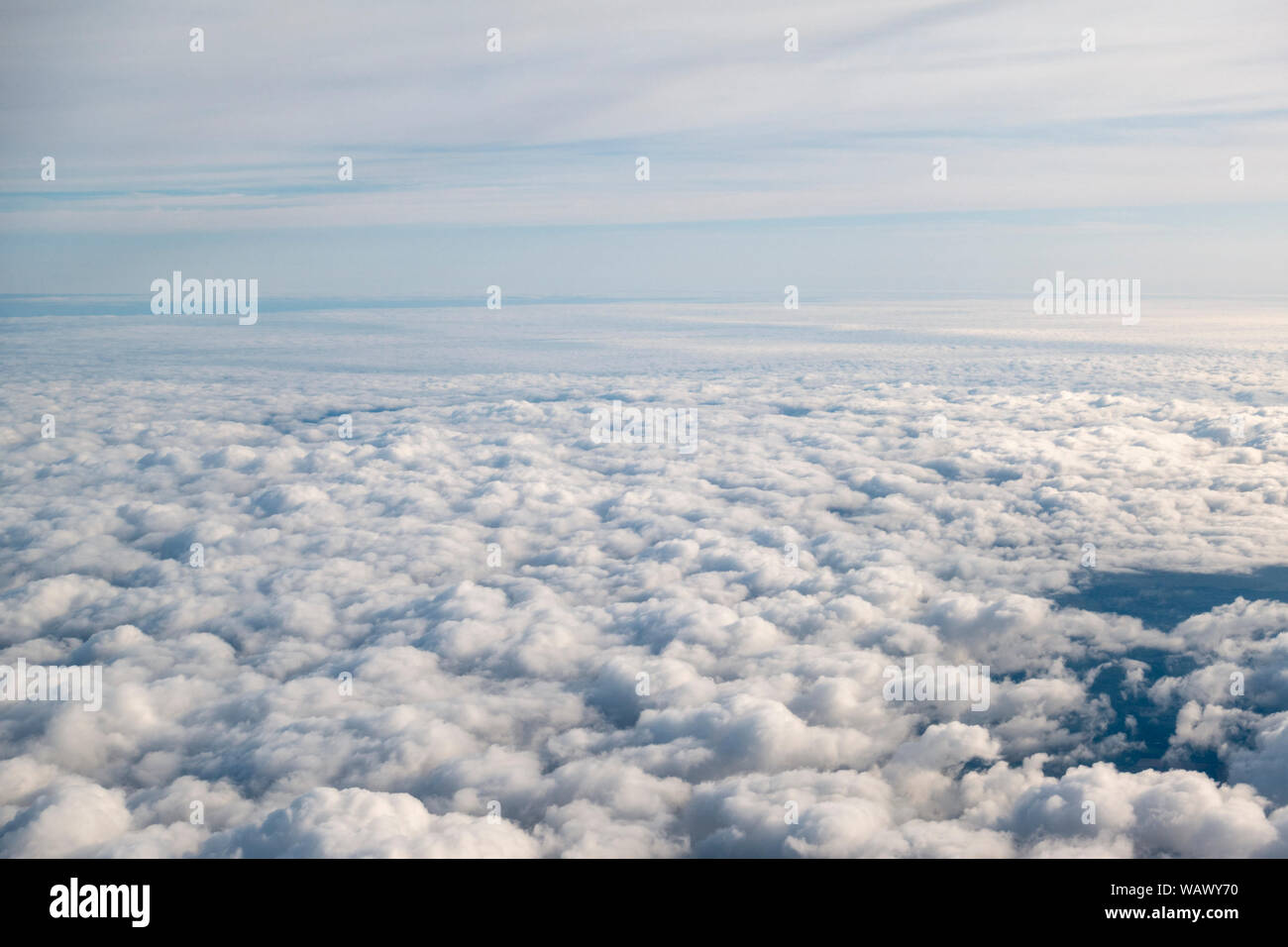 General view of low lying cloud viewed from a plane window over Europe. Stock Photo