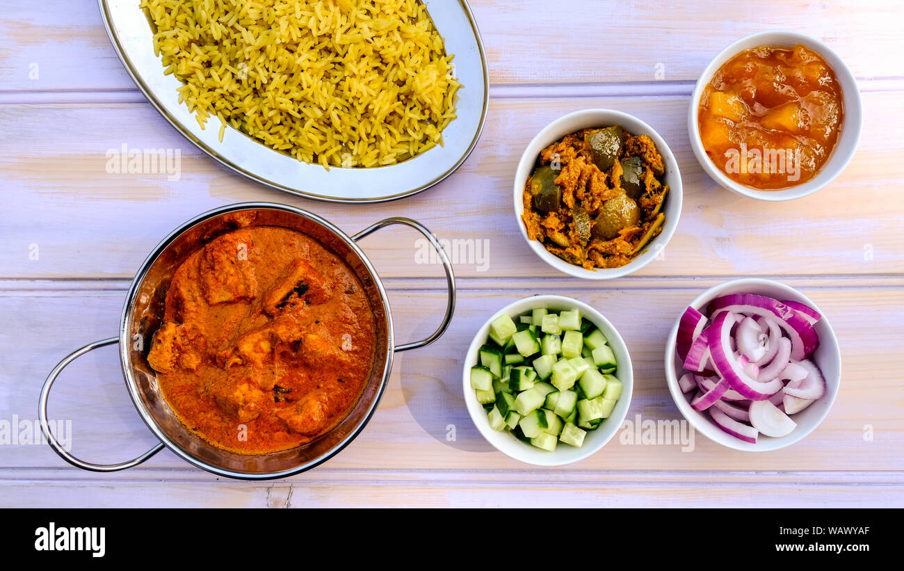 Indian Style Butter Chicken Curry and Pilau Yellow Rice Rice Stock