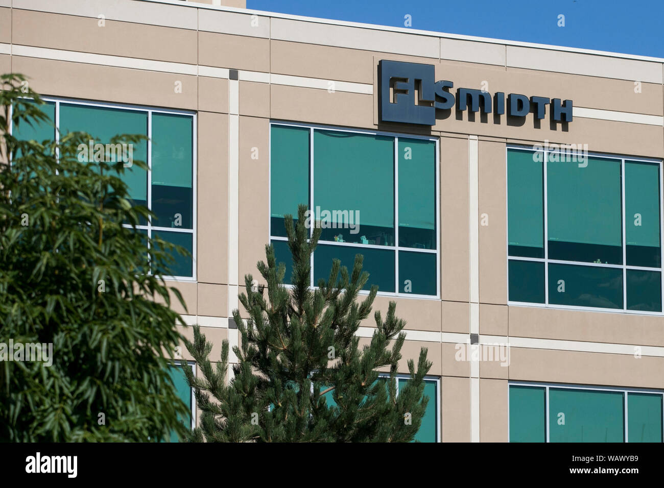 A logo sign outside of a facility occupied by FLSmidth & Co., in ...