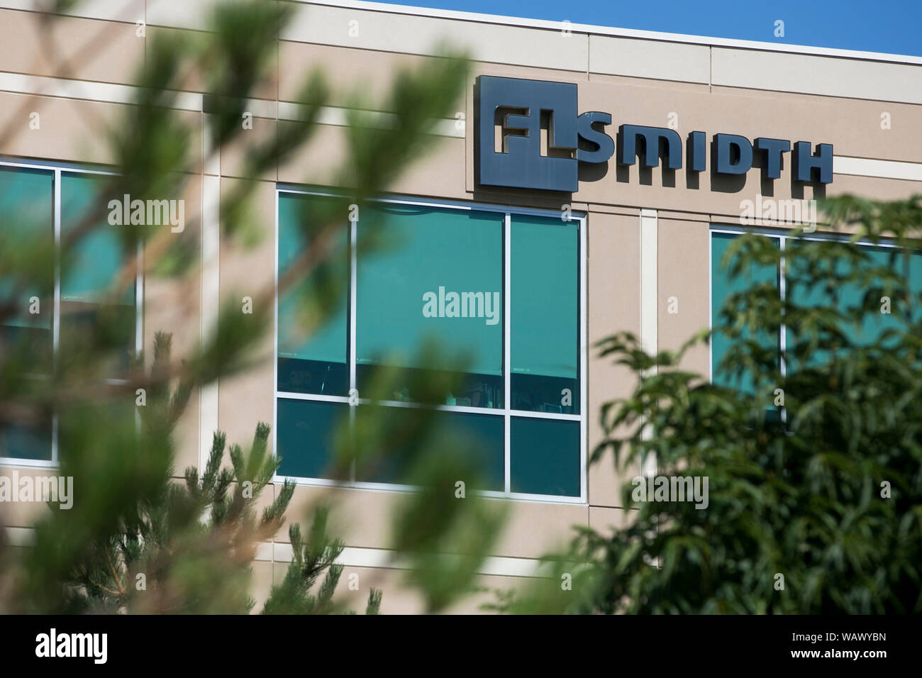 A logo sign outside of a facility occupied by FLSmidth & Co., in ...