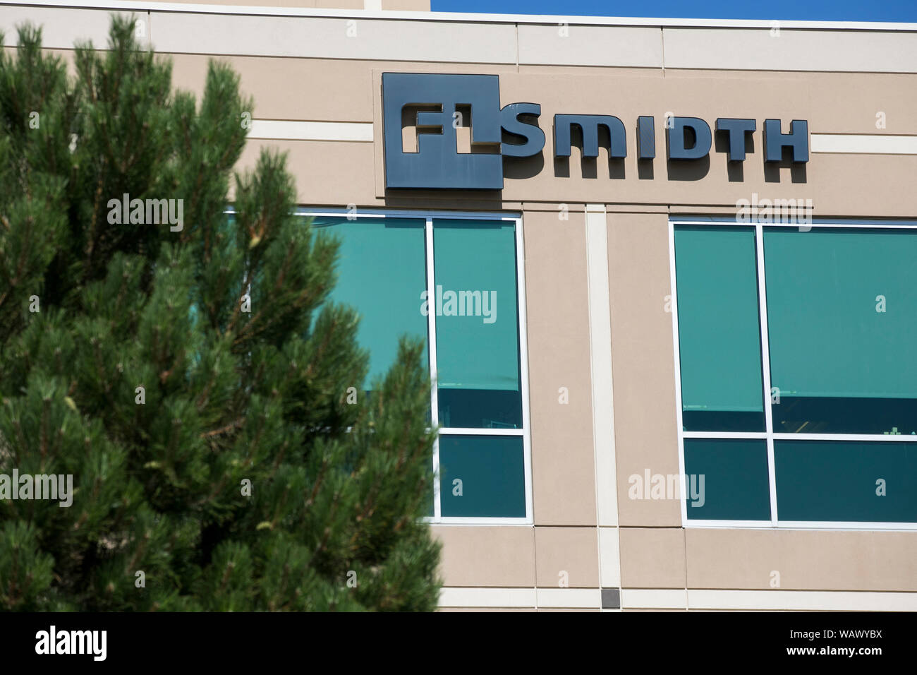 A logo sign outside of a facility occupied by FLSmidth & Co., in ...