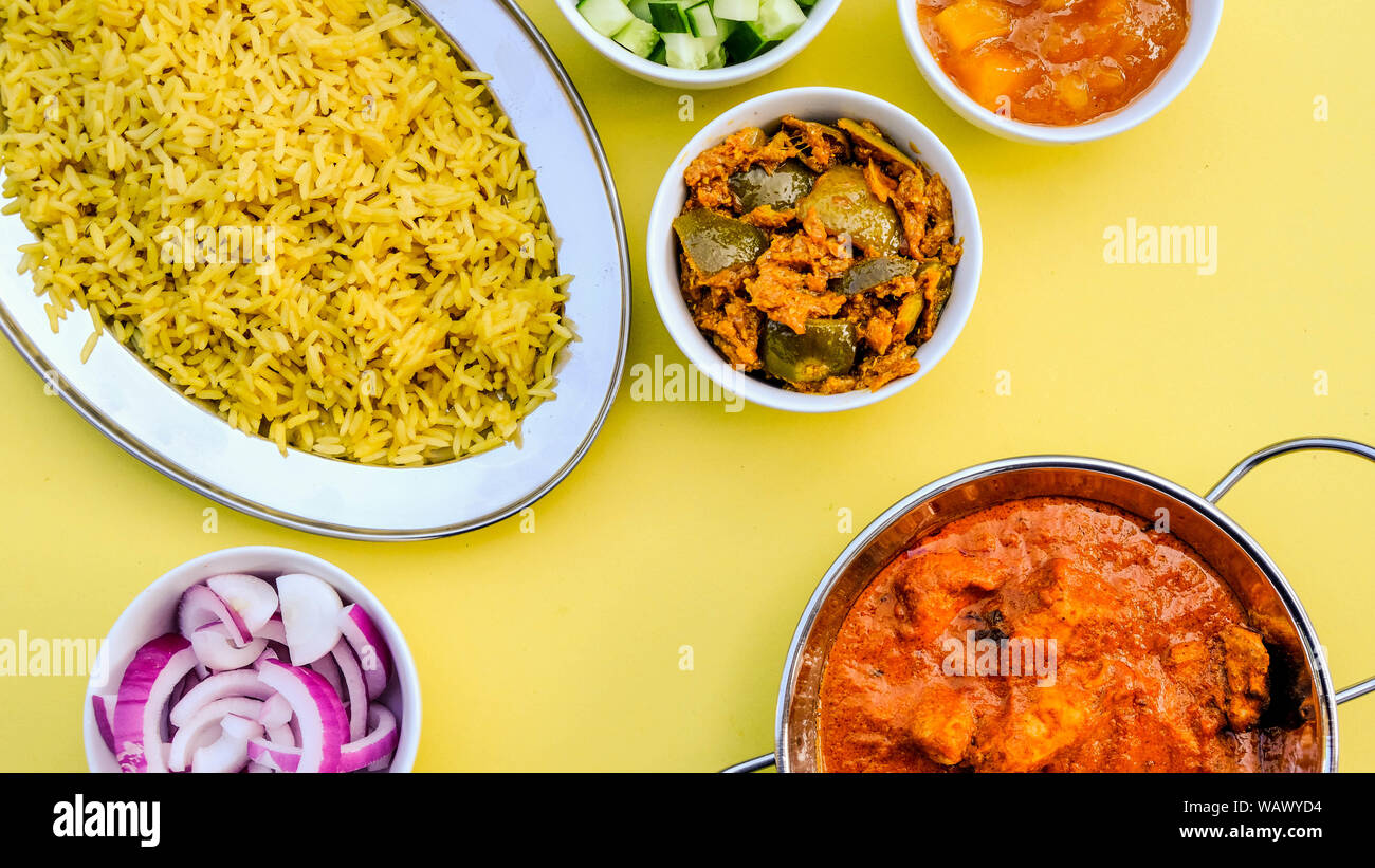 Indian Style Butter Chicken Curry and Pilau Yellow Rice Rice Stock