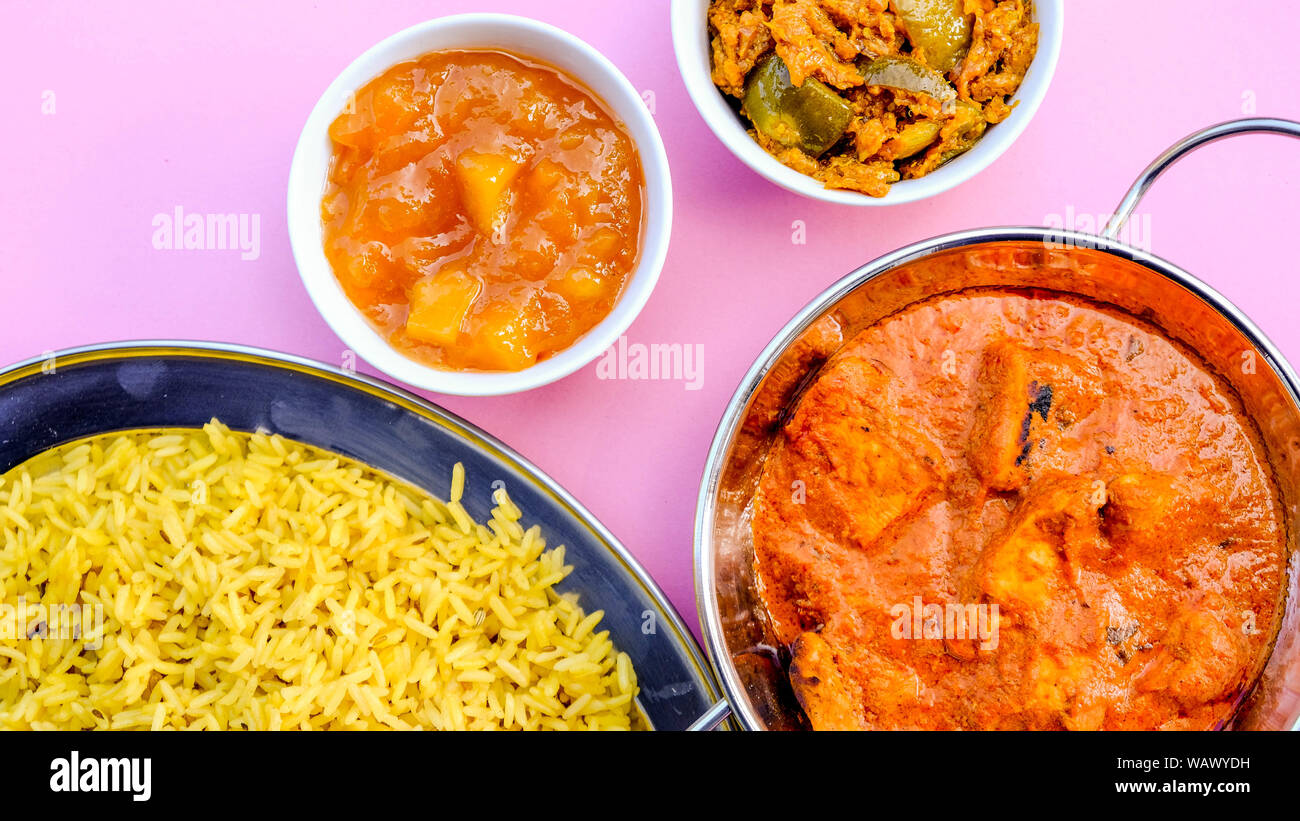 Indian Style Butter Chicken Curry and Pilau Yellow Rice Rice Stock