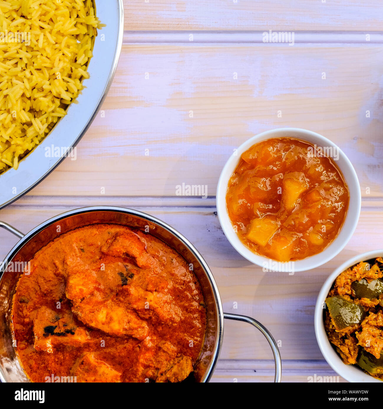 Indian Style Butter Chicken Curry and Pilau Yellow Rice Rice Stock