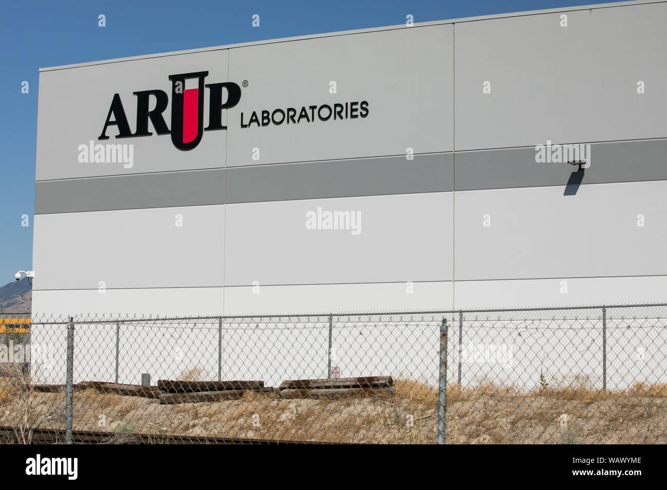 A logo sign outside of a facility occupied by ARUP Laboratories in Salt