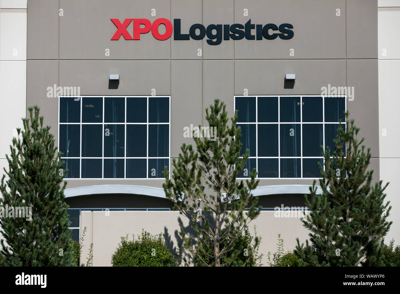 A logo sign outside of a facility occupied by XPO Logistics, Inc., in