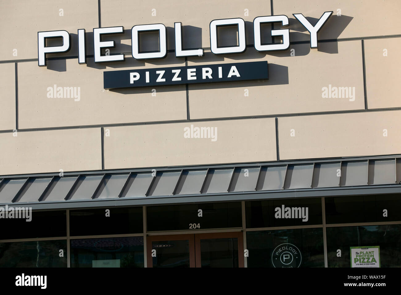 A logo sign outside of a Pieology Pizzeria restaurant location in Lehi, Utah on July 28, 2019
