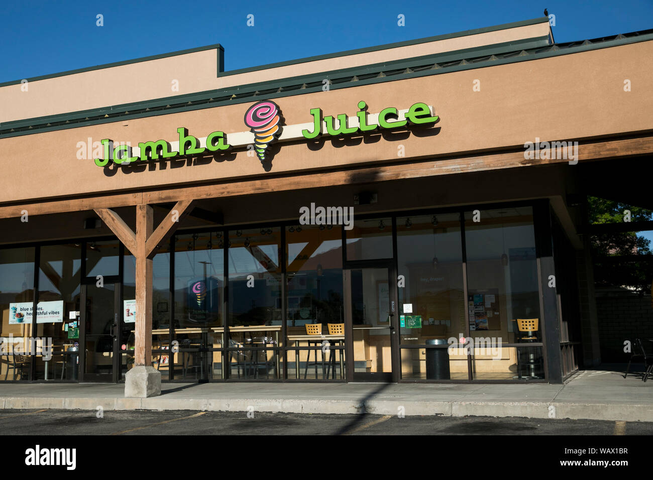 A logo sign outside of a Jamba Juice restaurant location in Draper