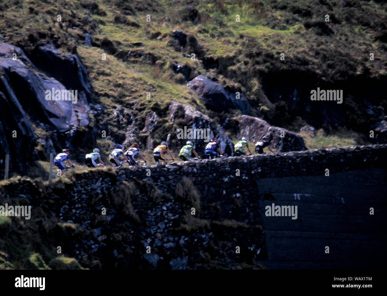 competition cyclists climbing a steep mountain pass dingle peninsula, county kerry, Ireland Stock Photo