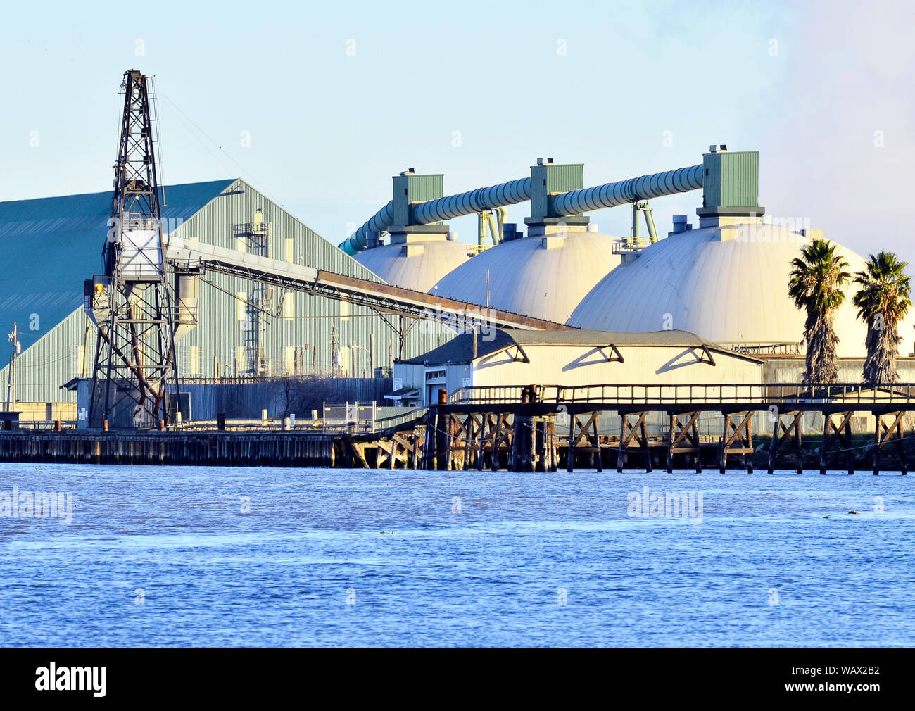 Koch Carbon, coke receiving and shipping facility on San Joaquin River. Pittsburg California, California Delta Stock Photo
