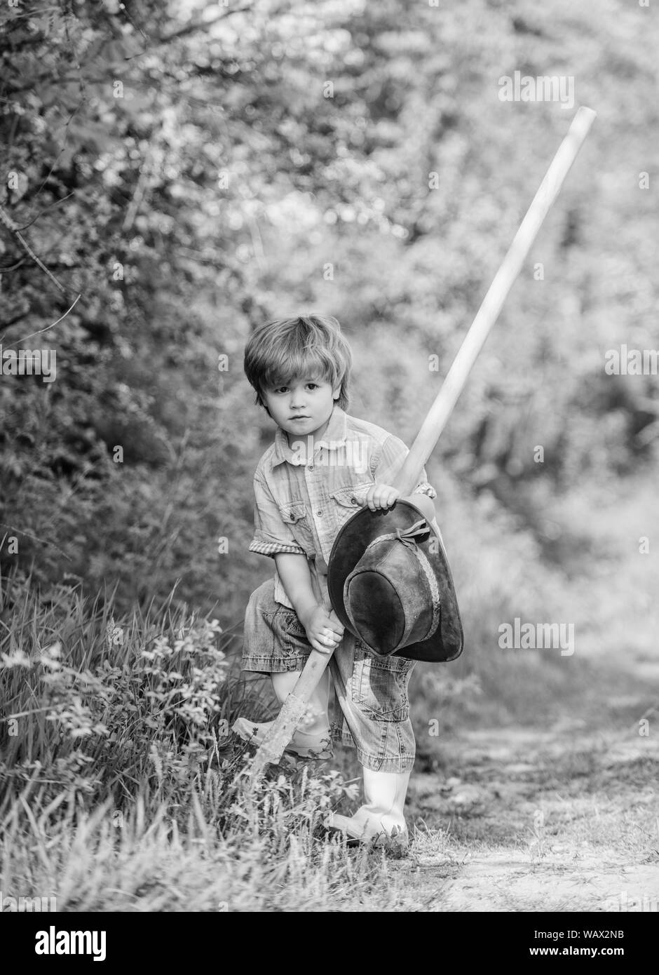 earth day. Eco life. summer activity. human and nature. happy child farmer use garden shovel, spring. small kid gardener planting a flower. farming and agriculture cultivation. Perfect spring day. Stock Photo