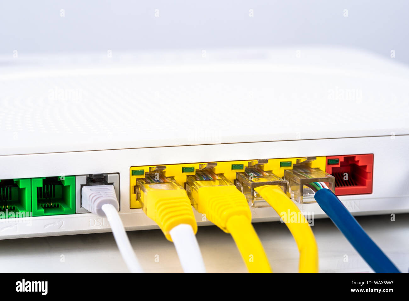 Close up of the back of a modem router with colourful network cables Stock  Photo - Alamy