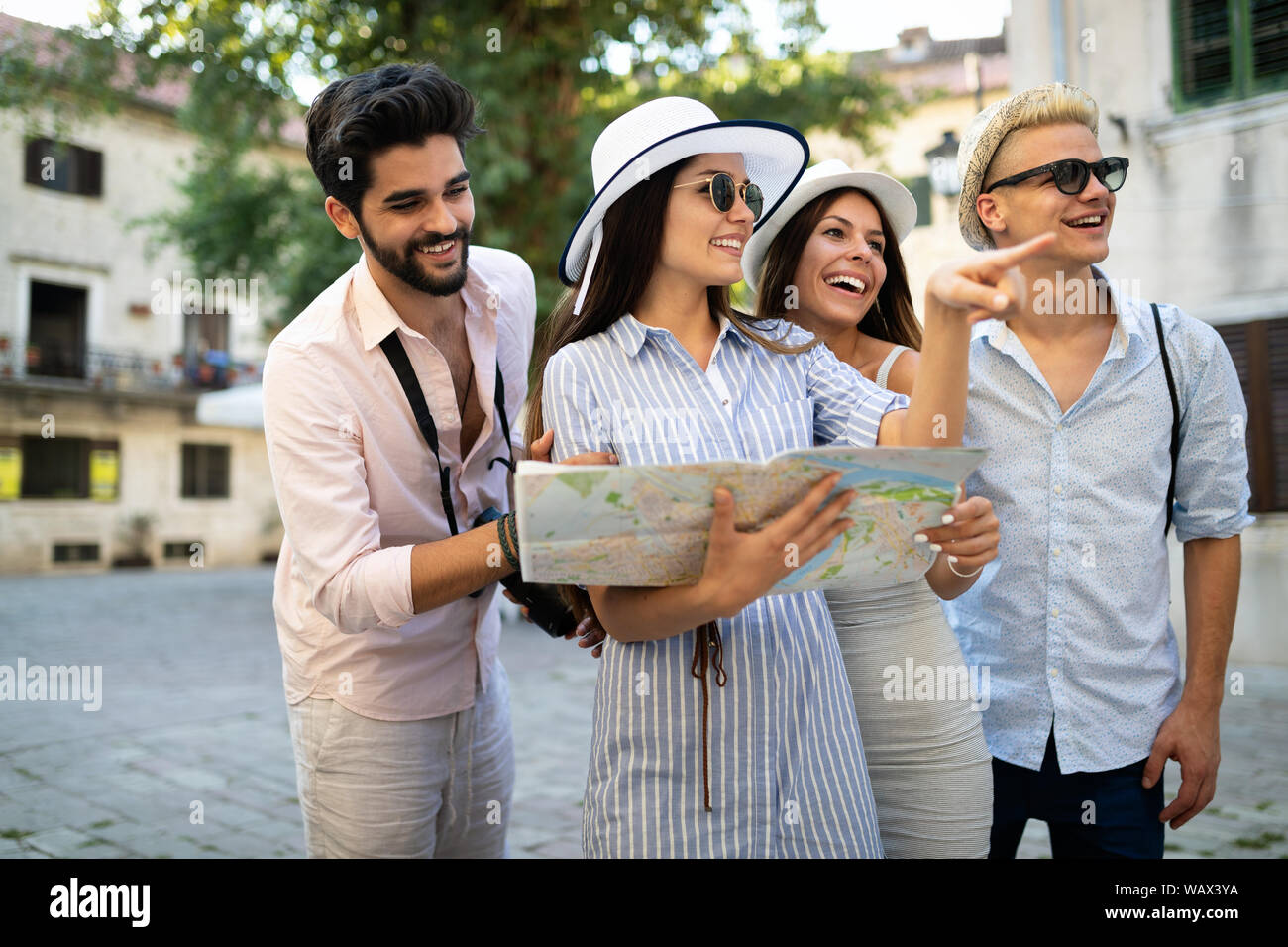 Group of friends spending quality time together in city Stock Photo