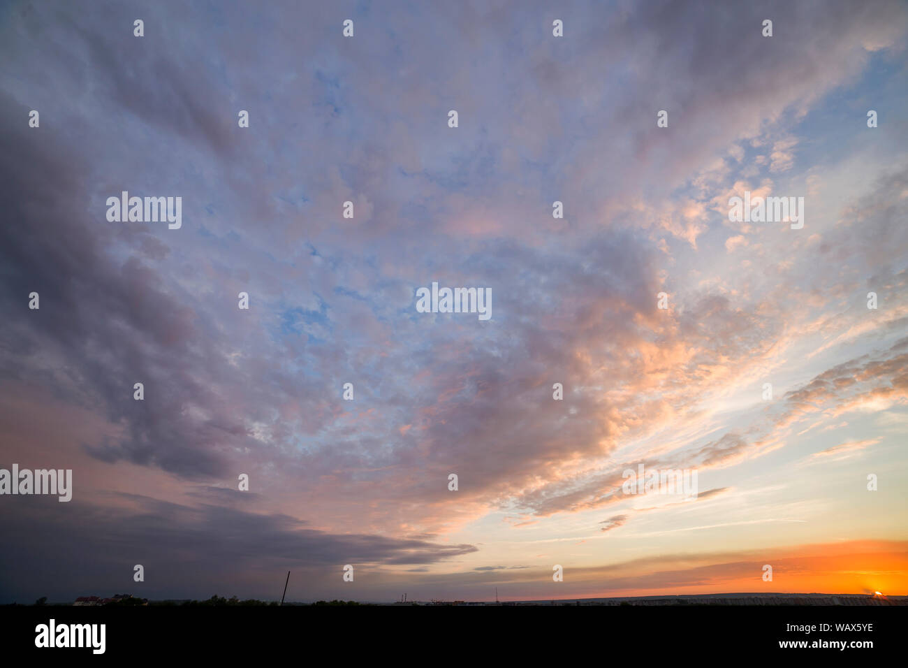 Dramatic sunset sky with orange clouds Stock Photo - Alamy