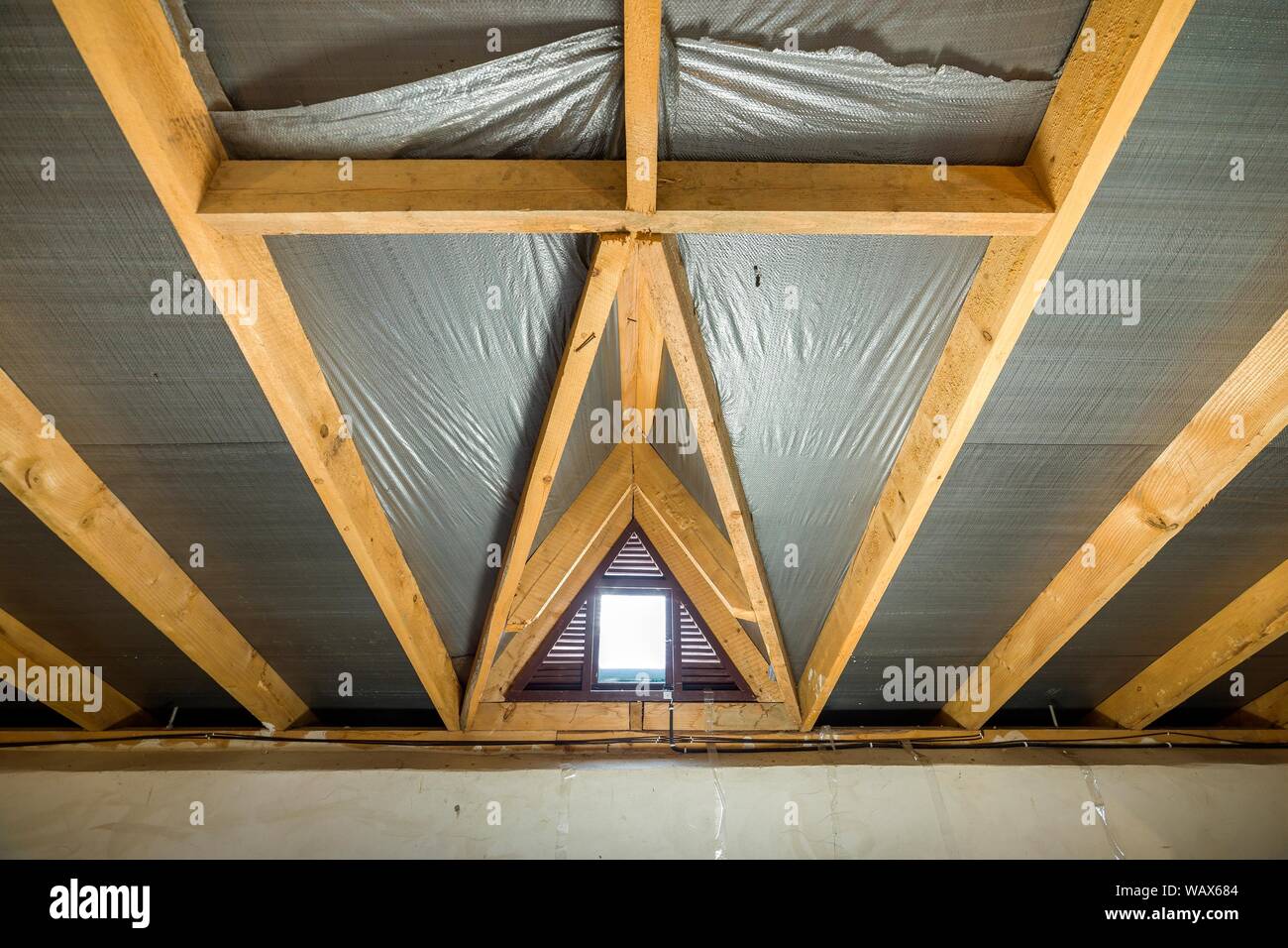 Attic Of A Building With Wooden Beams Of A Roof Structure And A