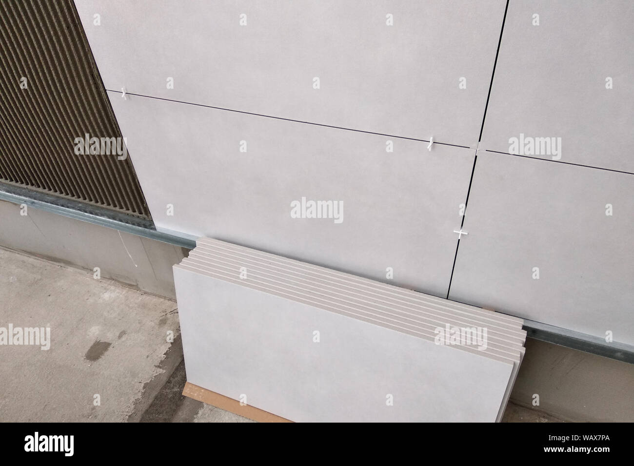 Wall ceramic tiles installation on mortar glue Stock Photo Alamy
