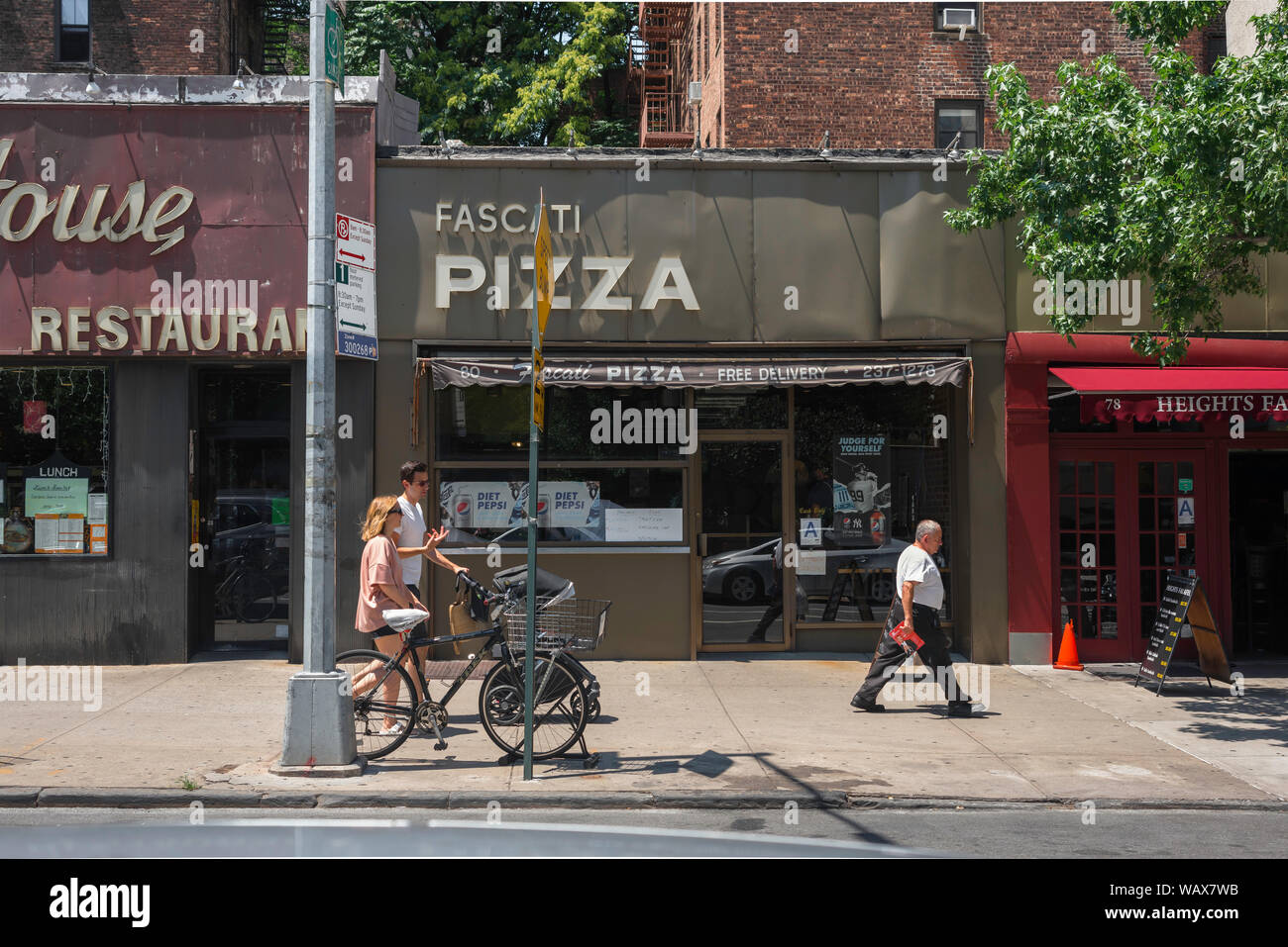 Brooklyn street, view in summer of people walking past shops in Henry Street, Brooklyn Heights, New York City, USA Stock Photo