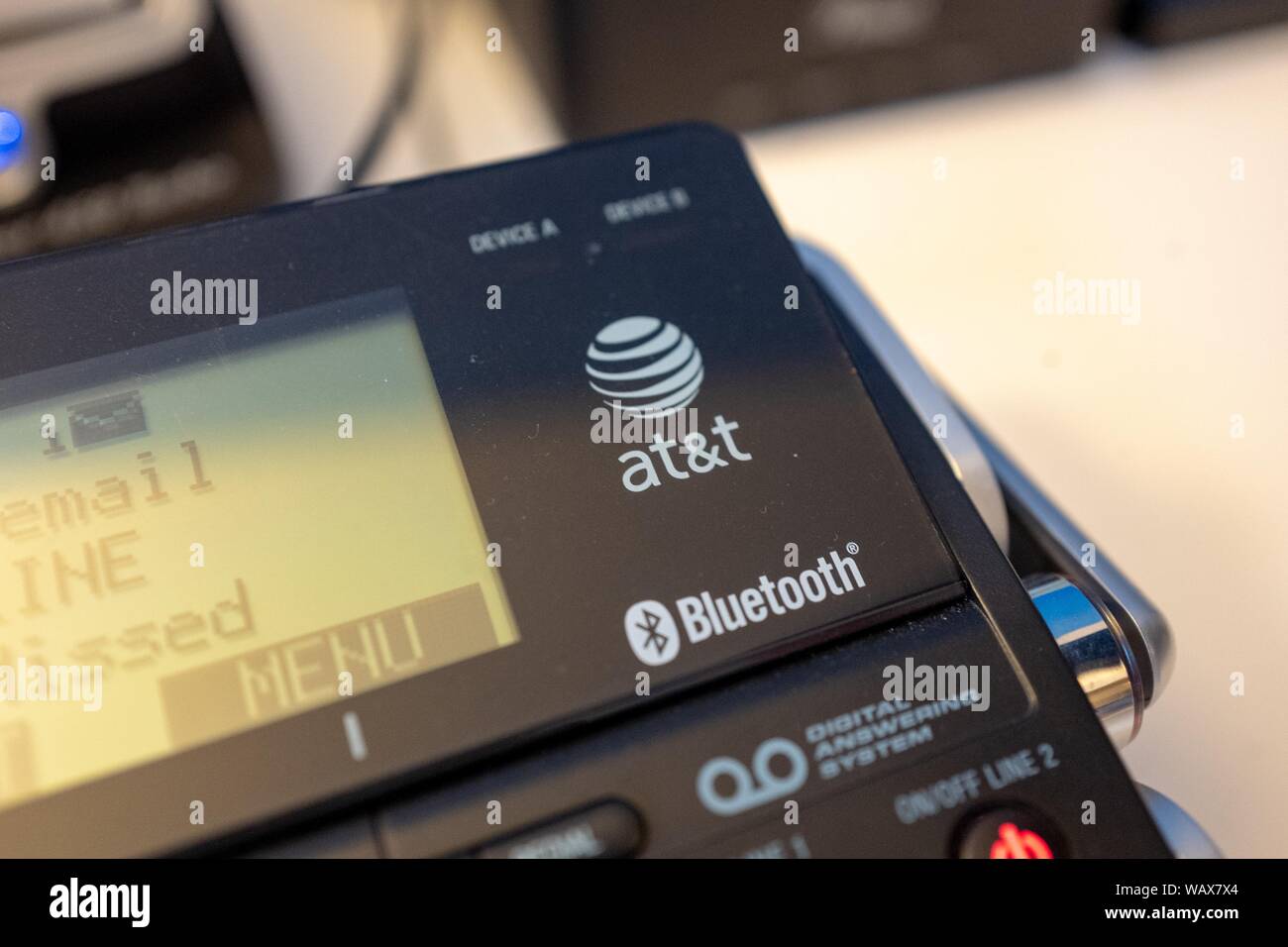 Closeup of logo for company ATT on a desktop phone