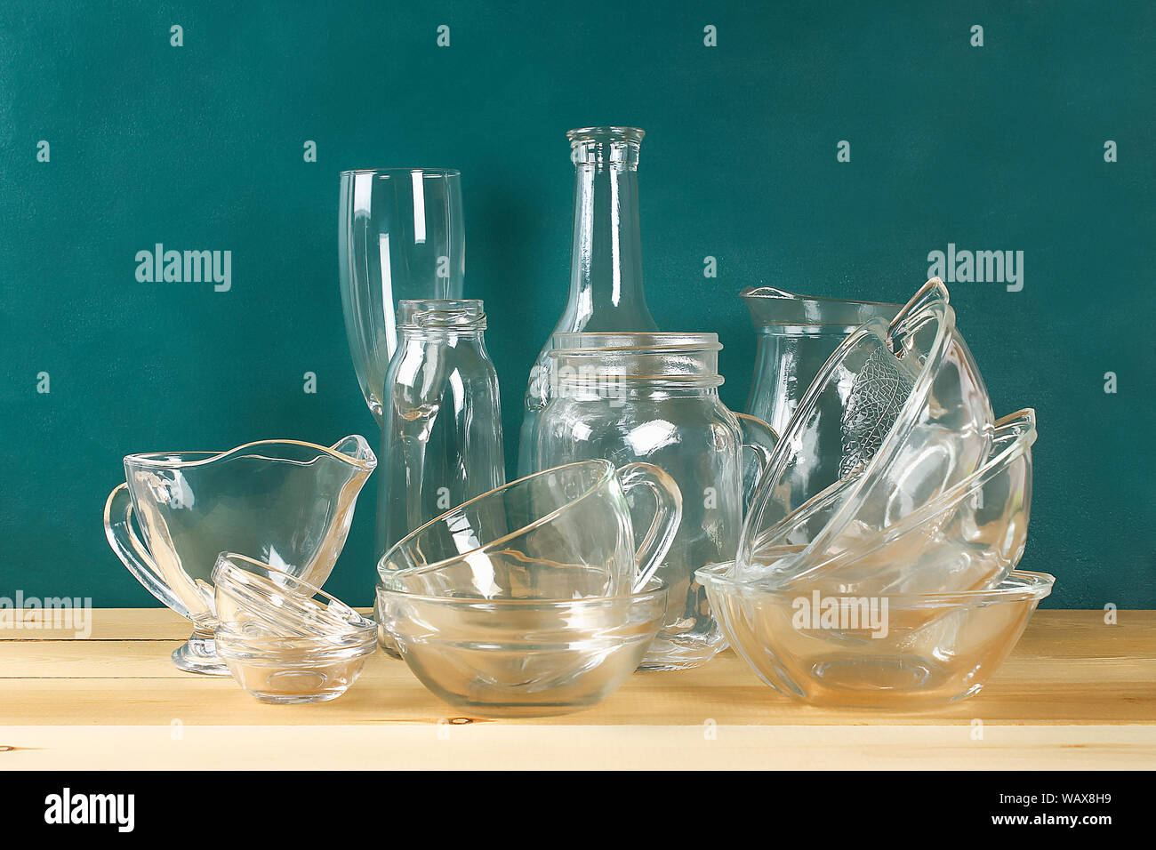 Glassware. Glass plates, cups, bowls Dishes on the shelf Kitchenware Stock  Photo - Alamy