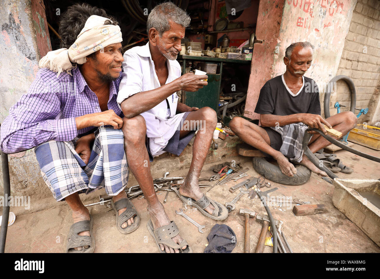 A group of workers in the streets of Madurai, India Stock Photo