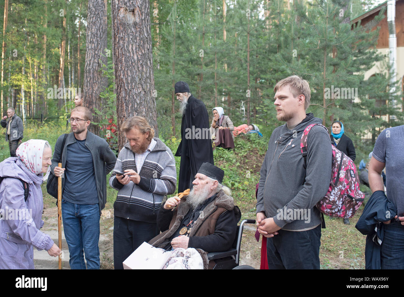 A monk of the monastery on behalf of the bearers of the Royal Passion in the Ganina Yama region in front of the pit prays where the Romanov family wer Stock Photo