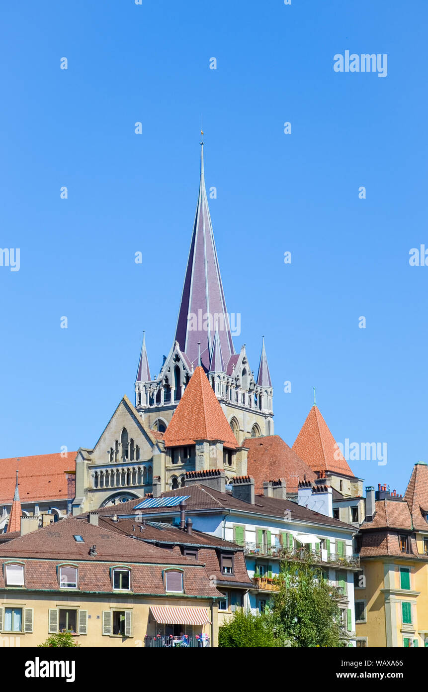 The tower of the Cathedral of Notre Dame in Lausanne, Switzerland. Located in canton Vaud. It belongs to the Evangelical Reformed Church. Religious buildings. Religion. Gothic architecture. Stock Photo