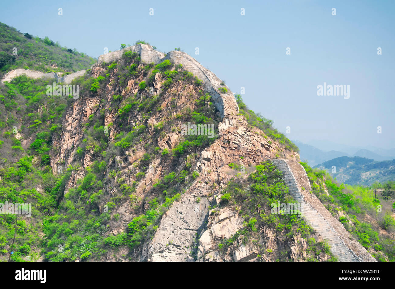 Crumbling Great Chinese Wall running down a hill, Huanghua Great Wall of  China, Great Wall