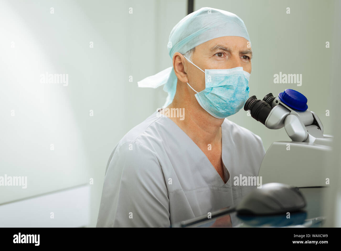 Nice good looking man working as an ophthalmologist Stock Photo