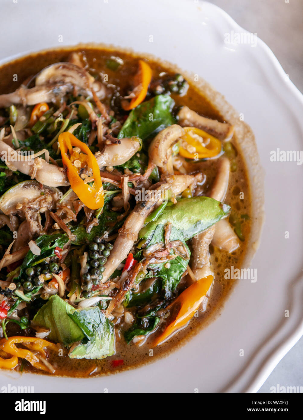 Thai very spicy stir fried razor clams with Thai local herbs, kaffir ...