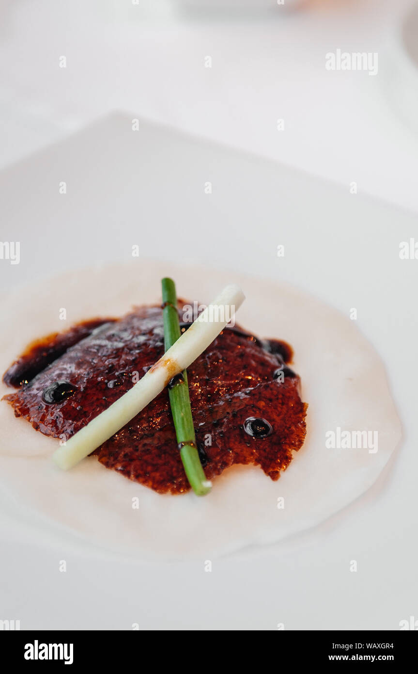 Roasted Peking duck or Beijing duck crispy skin with sweet Hoisin sauce