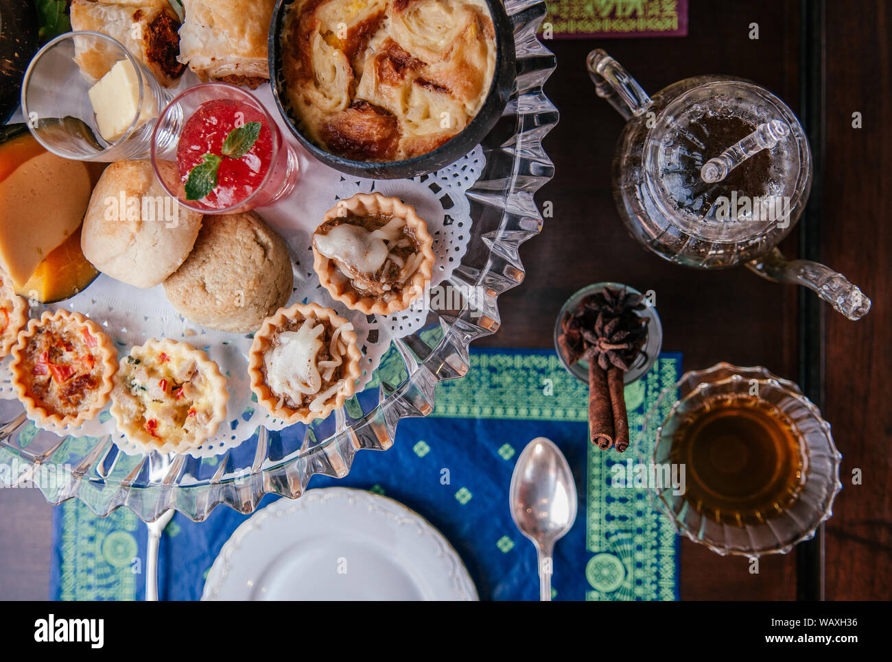 Traditional Elegance English Afternoon Tea With Scone Assorted Tart And Puff Pastries On Old Wood Table With Tea Pot And Tea Cup Top View Stock Photo Alamy