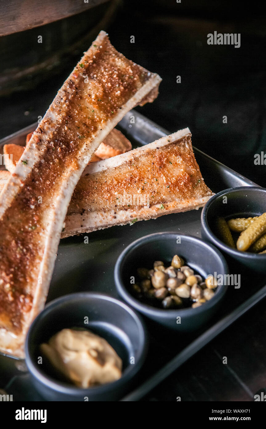 Roasted beef bone marrow and Grilled Bread Slices Stock Photo Alamy