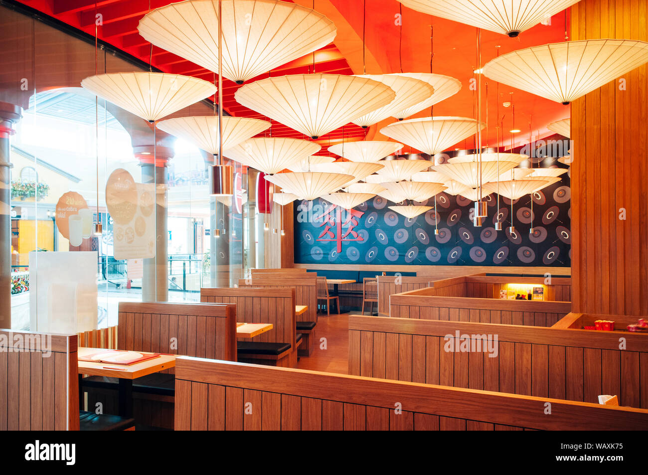 OCT 30, 2013 Bangkok, THAILAND - Vibrant Japanese restaurant interior,  decorated ceiling with paper umbrellas, warm tone lighting and wooden  furniture Stock Photo - Alamy