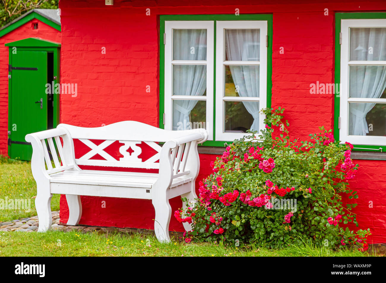 Bench in front of a house, Village Nebel, island Amrum Stock Photo