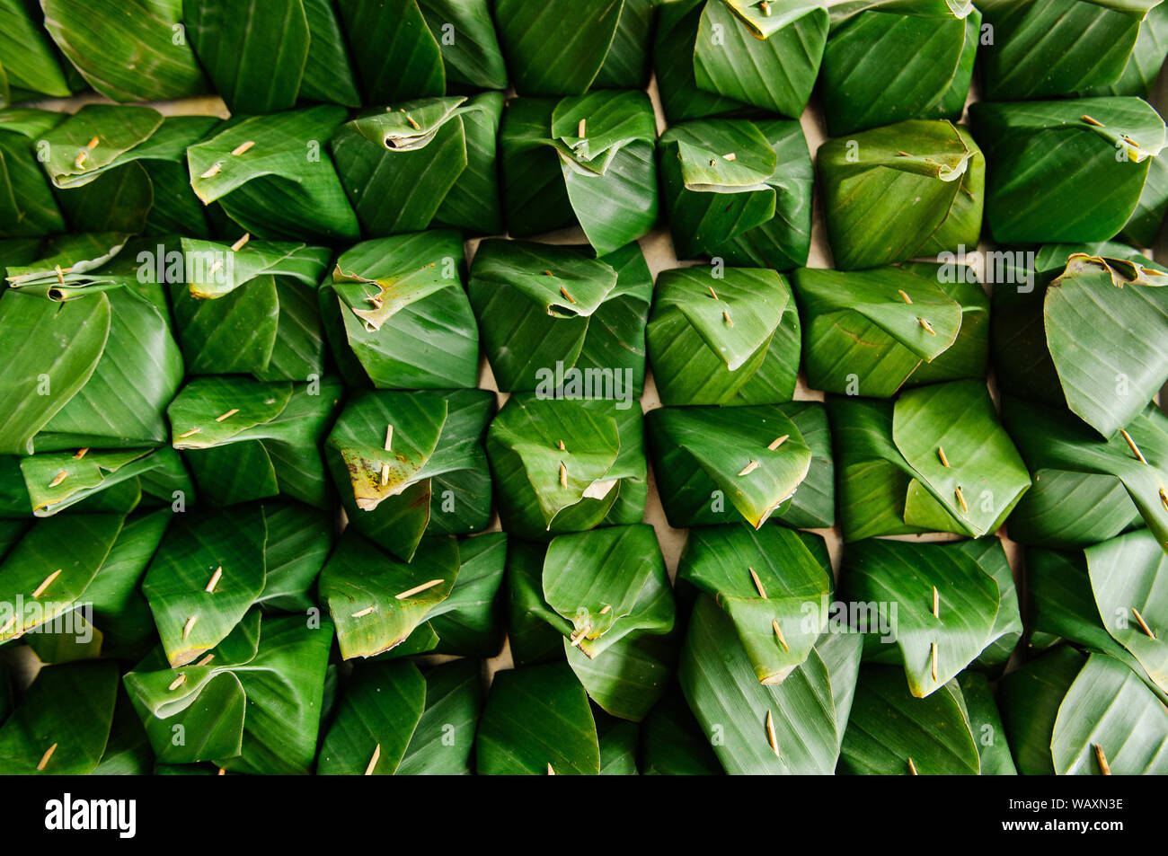 Many traditional Thai banana leaf wrapped dessert top view detail