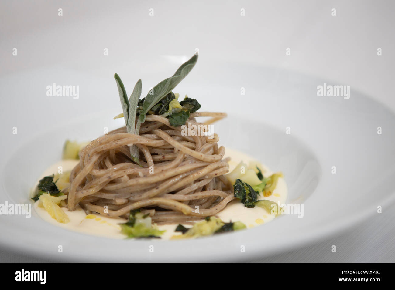 Close up on a dish with italian recipe, pasta with rosmarino, served in a gourmet flavour Stock Photo