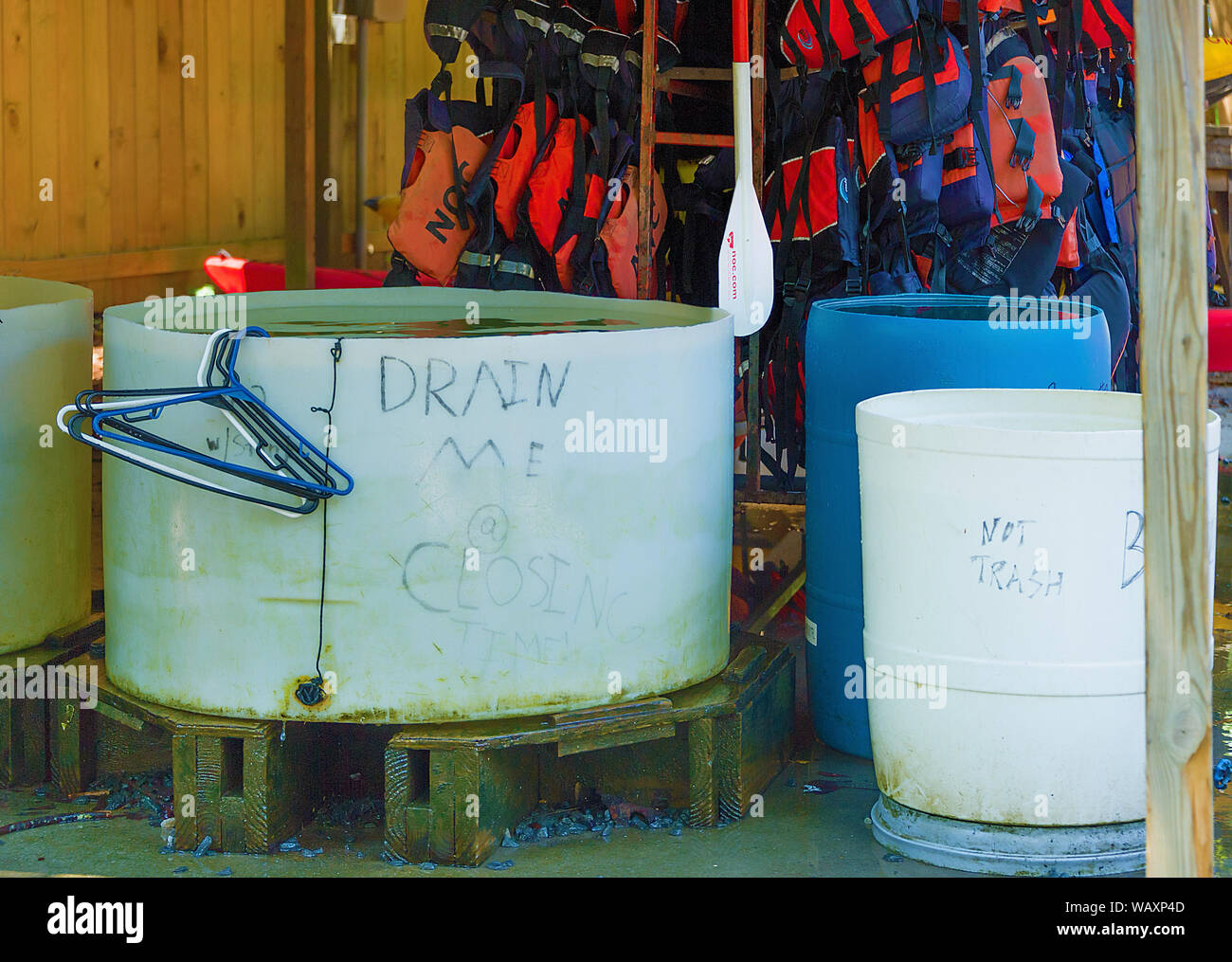 Bryson, North Carolina, USA - August 3, 2019:  Outside rinsing containers for equipment used by patrons renting equipment at Nantahala Outdoor Center. Stock Photo